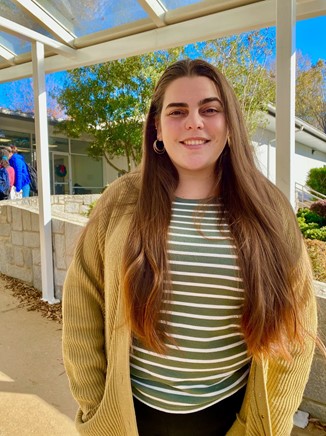 Jessica Luzardo poses outside her classroom. 