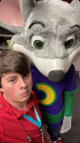 AJ Chambers poses with Chuck E. Cheese
