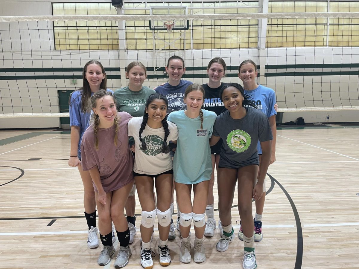 Photo of Varsity Volleyball Team. Pictured from Top Left to Bottom Right: Nina Kline, Veronika Babbitt, Emma-Jane Kirk, Sally Swann, Millie Pugmire, Reese Jarrard, Jiya Patel, Caddie Grow, Chloe Love-Bell
