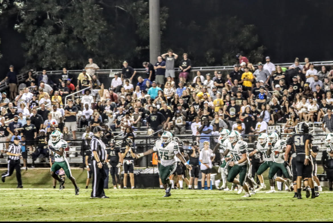 Spartan football team on the field.